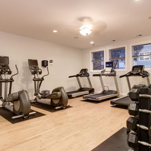 Quick access to state-of-the-art amenities a gym with exercise equipment